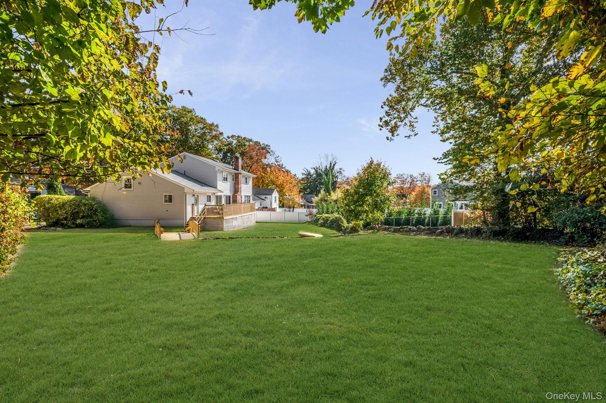 63 Underhill Road Scarsdale, NY 10583 - Photo 30 of 36 View of yard with a deck