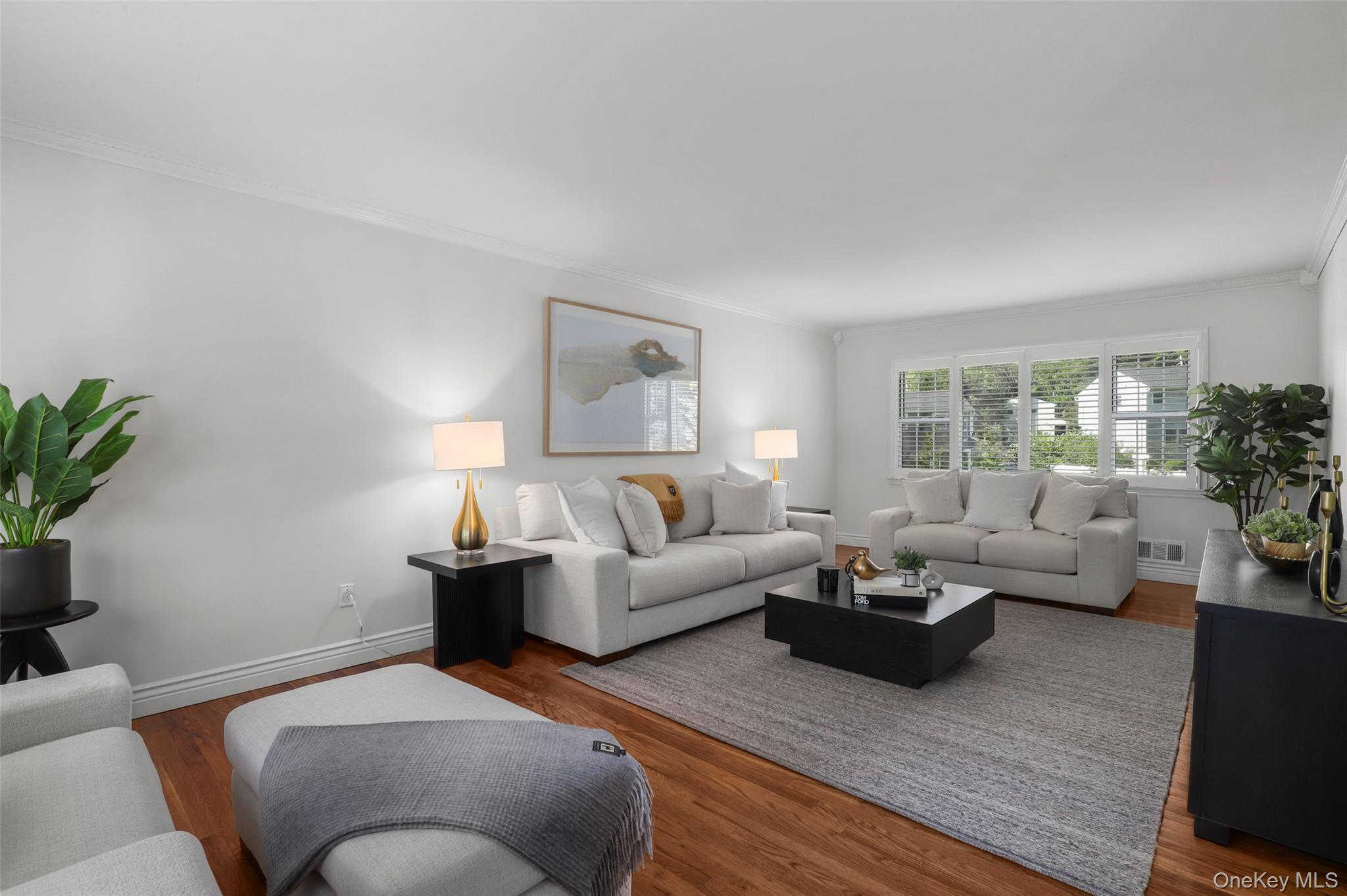 63 Underhill Road Scarsdale, NY 10583 - Photo 6 of 36 Spacious Living Room featuring plantation shutters