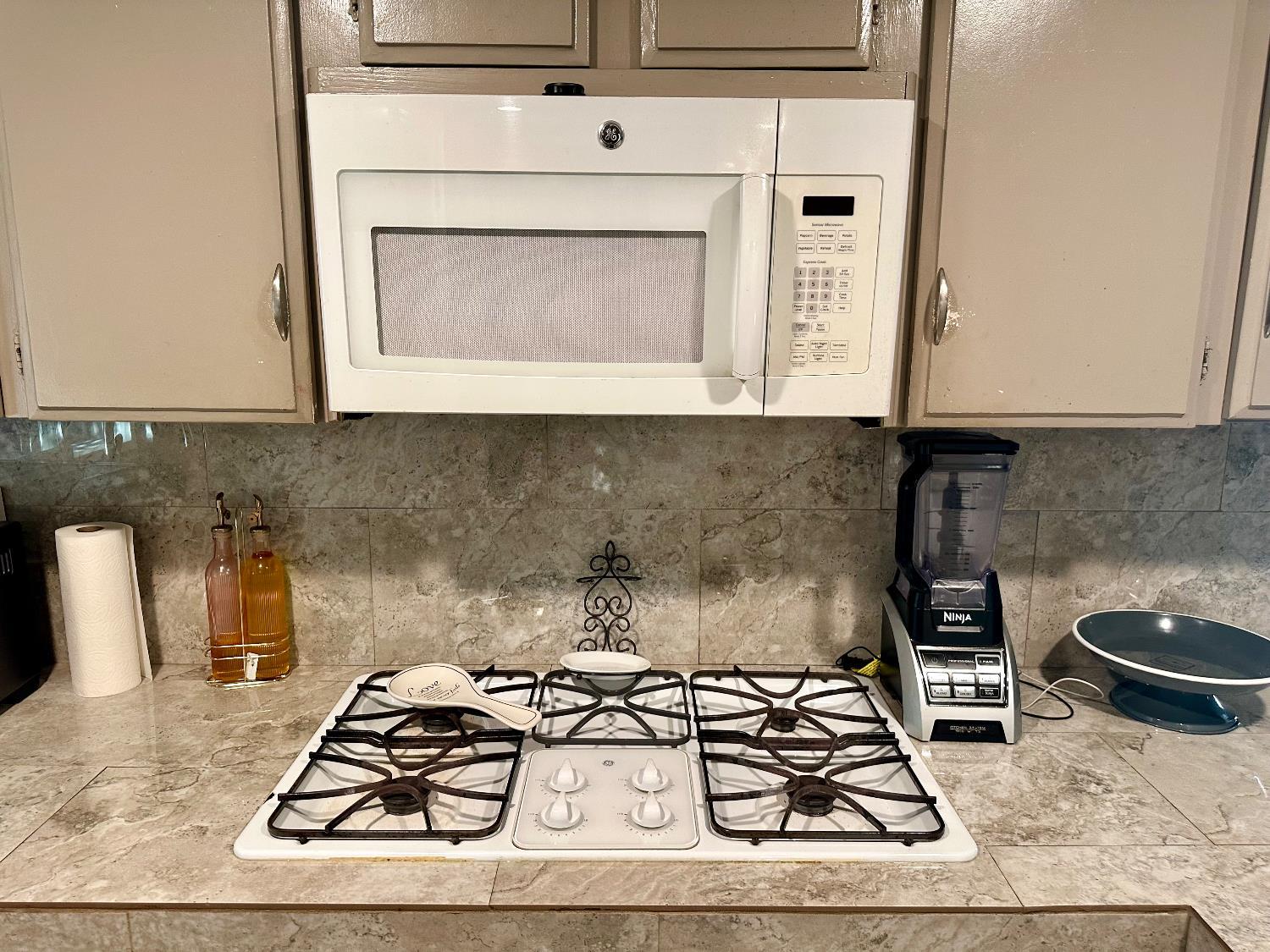 3435 Marfargoa Road, Unit 74 Stockton, CA 95215 - Photo 18 of 21 a kitchen with a stove and cabinets