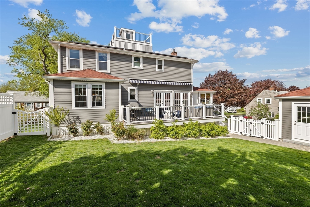 19 Damon Road Scituate, MA 02066 - Photo 4 of 29 a front view of a house with a yard table and chairs