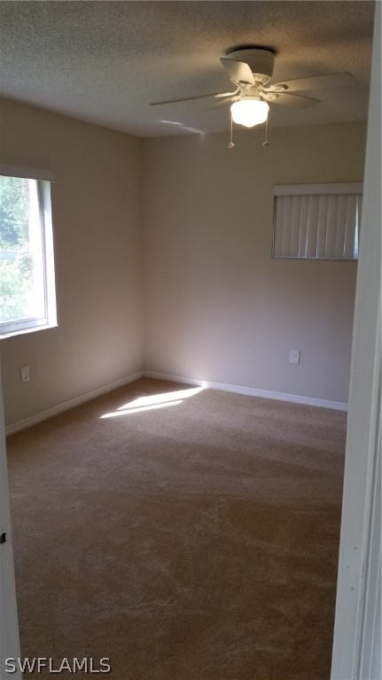 5665 Whitaker Road, Unit A101 Naples, FL 34112 - Photo 11 of 17 a view of empty room with window