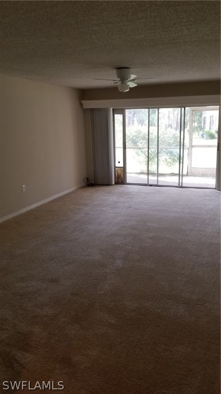 5665 Whitaker Road, Unit A101 Naples, FL 34112 - Photo 4 of 17 a view of an empty room with a window