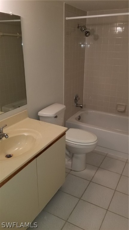 5665 Whitaker Road, Unit A101 Naples, FL 34112 - Photo 8 of 17 a bathroom with a sink a toilet and shower
