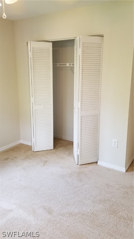5665 Whitaker Road, Unit A101 Naples, FL 34112 - Photo 10 of 17 a view of an empty room