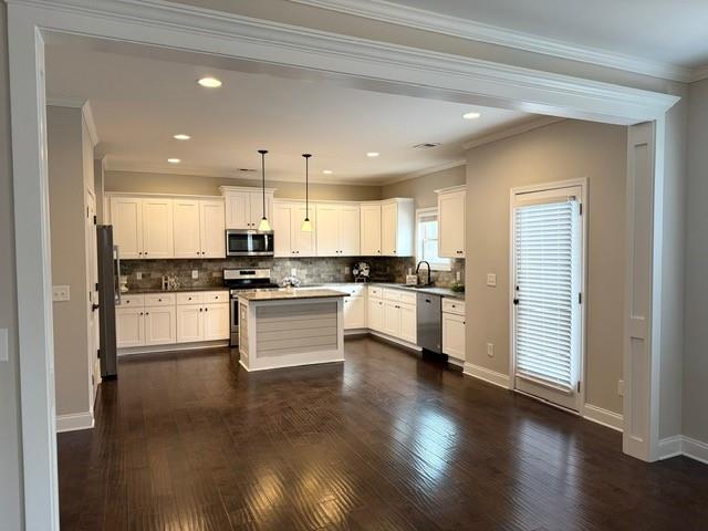 116 Teramont Court Dallas, GA 30132 - Photo 2 of 19 a large kitchen with white cabinets stainless steel appliances and wooden floor