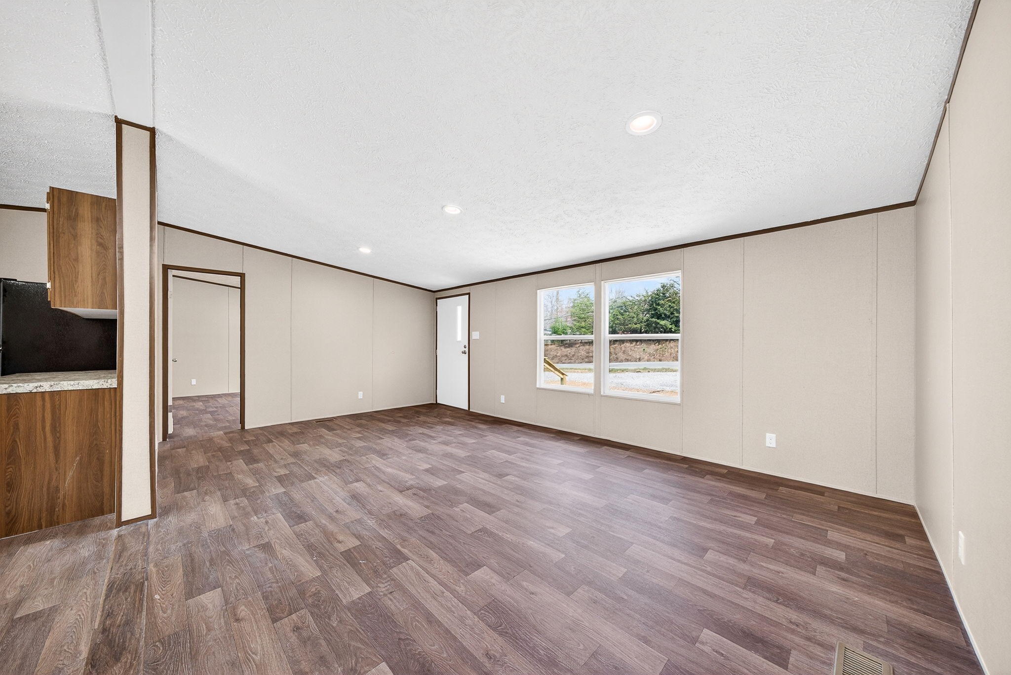 428 Maple Branch Road Sparta, TN 38583 - Photo 11 of 28 a view of an empty room with wooden floor and a window