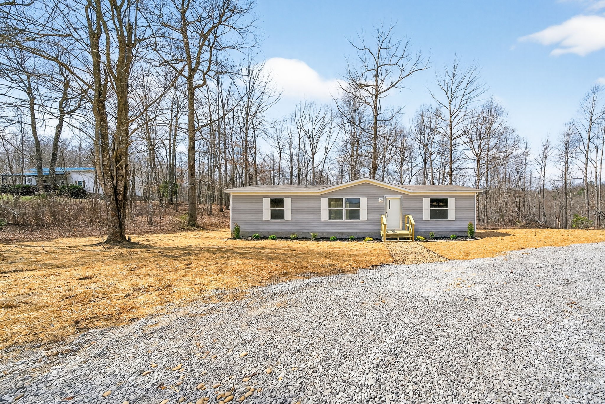 428 Maple Branch Road Sparta, TN 38583 - Photo 2 of 28 a front view of house with yard and trees