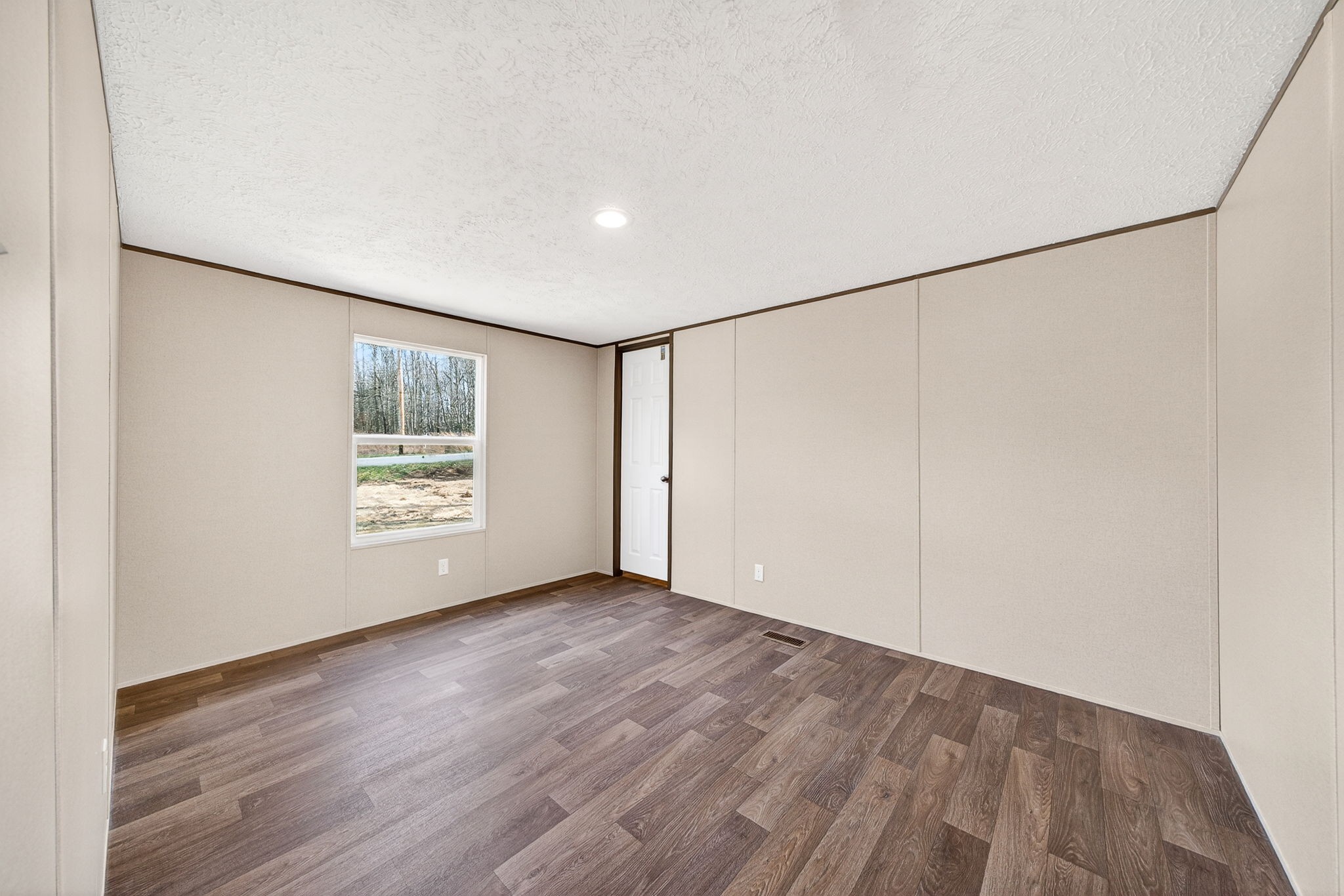 428 Maple Branch Road Sparta, TN 38583 - Photo 24 of 28 a view of an empty room with wooden floor and a window