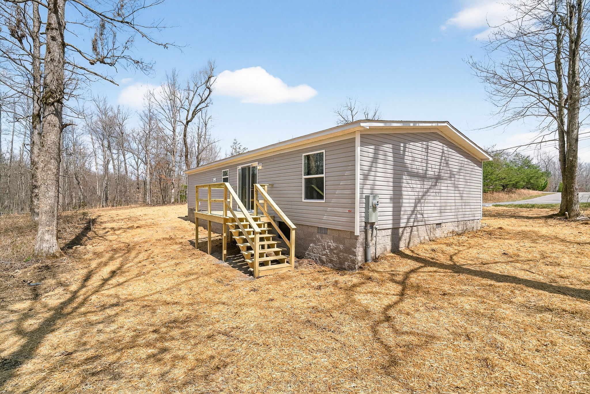 428 Maple Branch Road Sparta, TN 38583 - Photo 5 of 28 a front view of a house with a yard