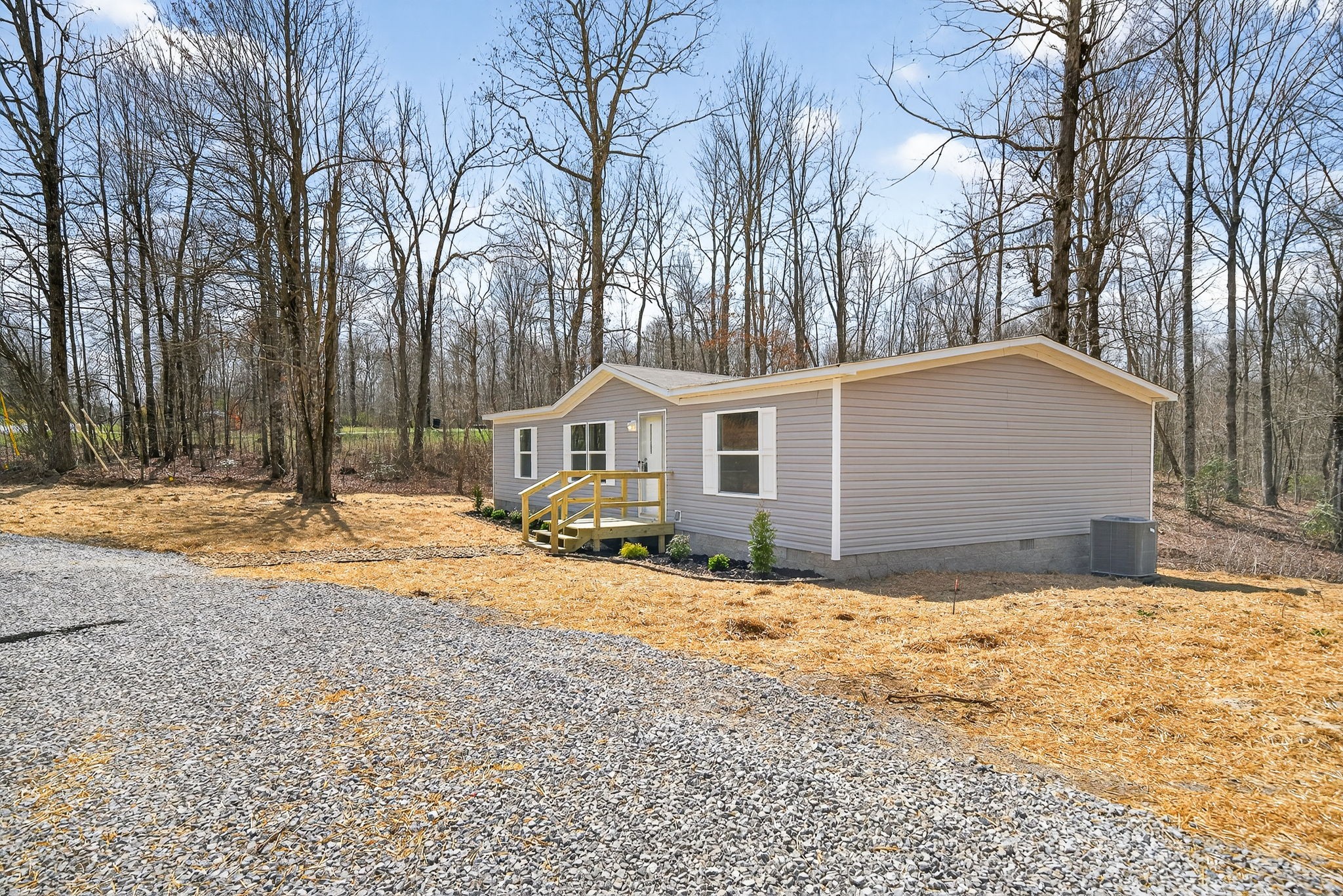 428 Maple Branch Road Sparta, TN 38583 - Photo 8 of 28 a white house that has a tree in front of it