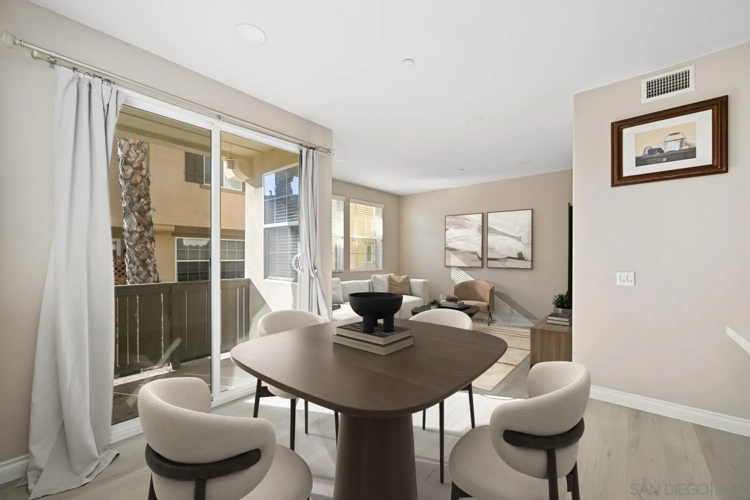 5074 Cascade Way, Unit 102 Oceanside, CA 92057 - Photo 11 of 30 a dining room with furniture and wooden floor