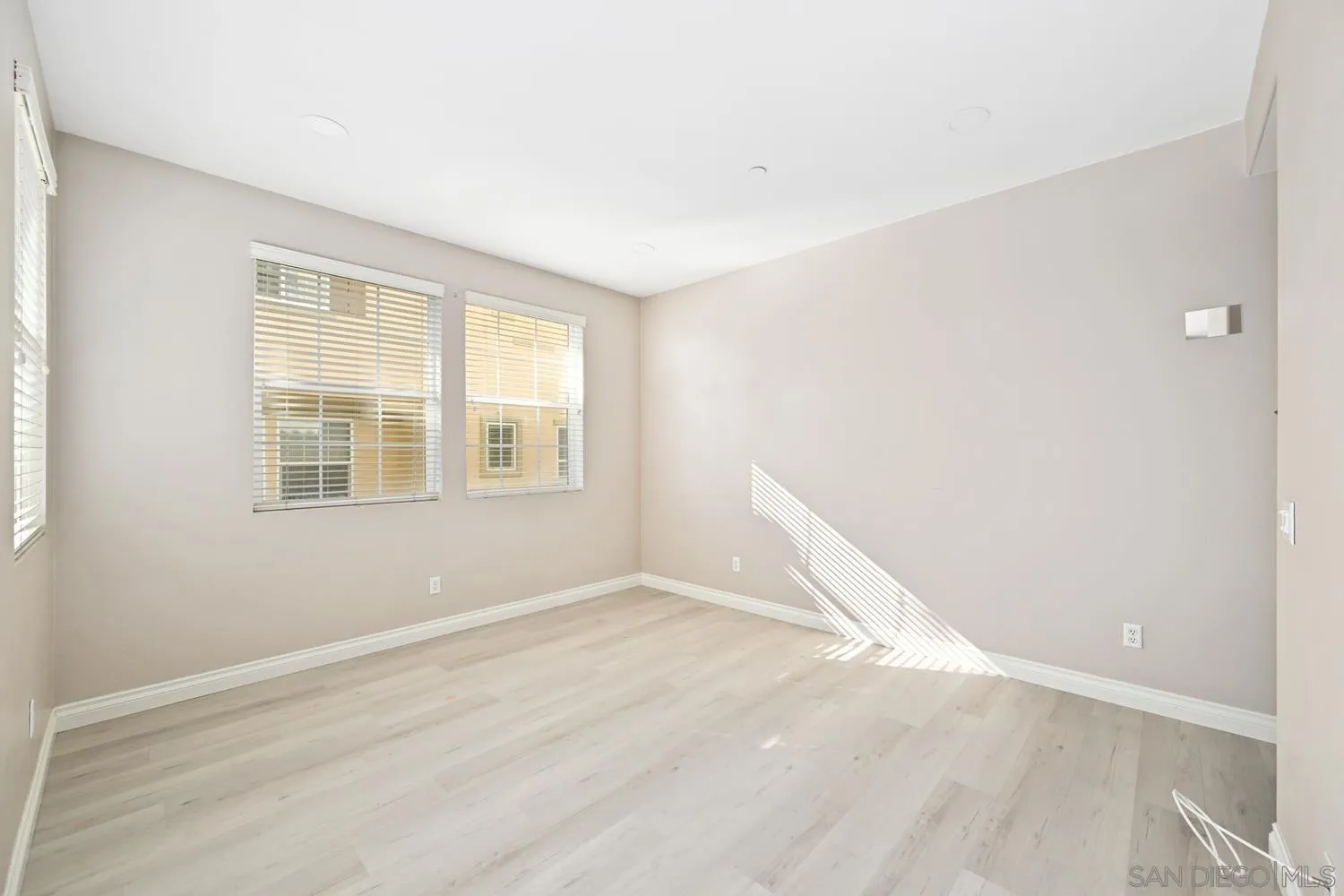 5074 Cascade Way, Unit 102 Oceanside, CA 92057 - Photo 16 of 30 a view of an empty room with a window