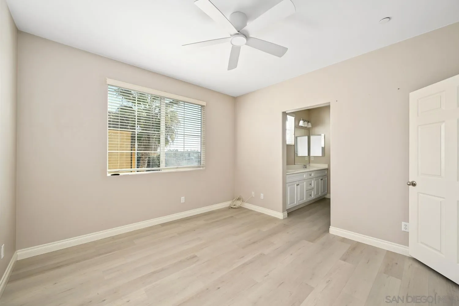 5074 Cascade Way, Unit 102 Oceanside, CA 92057 - Photo 17 of 30 wooden floor in an empty room with a window