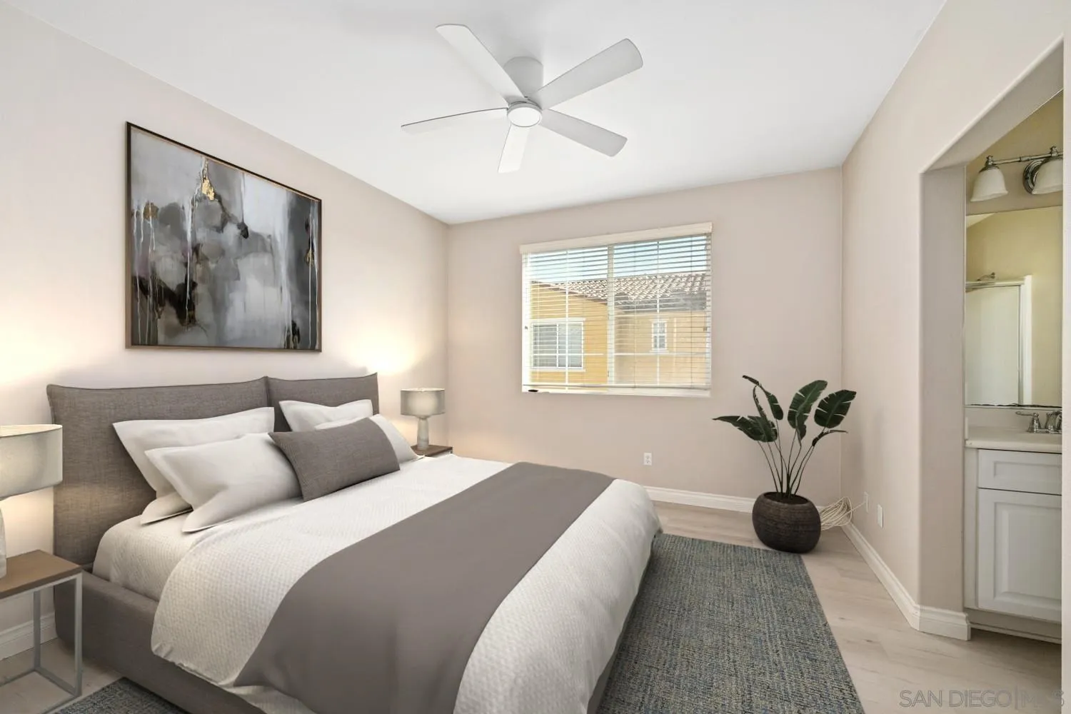 5074 Cascade Way, Unit 102 Oceanside, CA 92057 - Photo 20 of 30 a bedroom with a bed and a painting on the wall