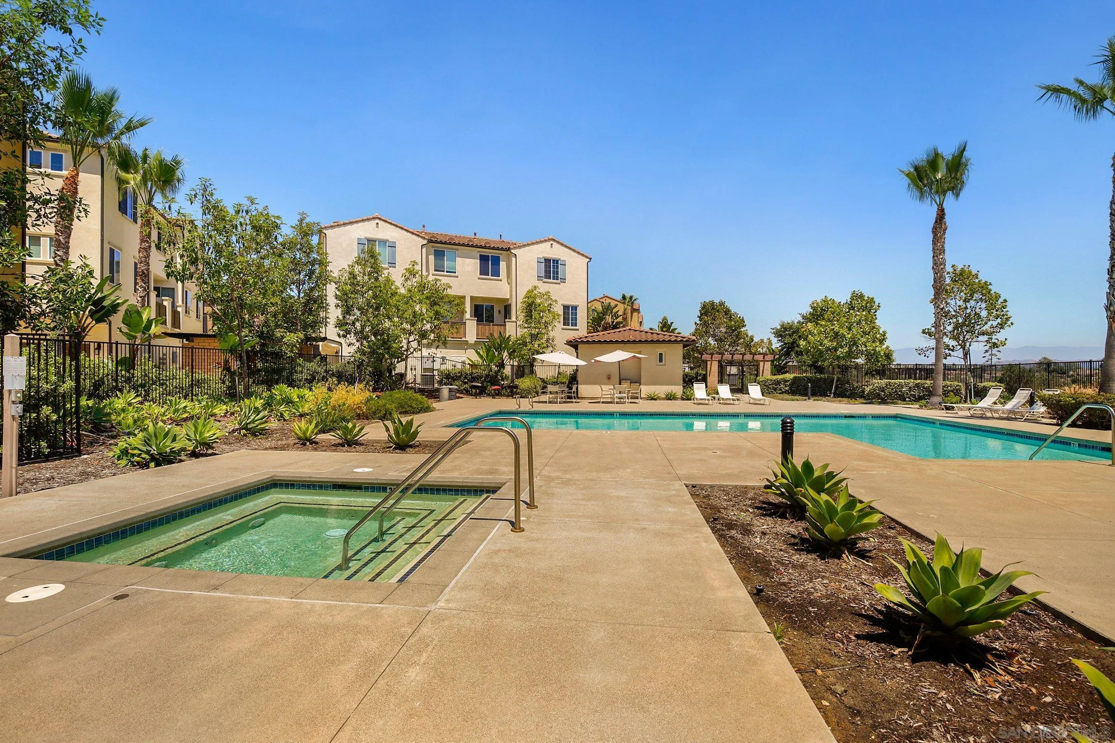 5074 Cascade Way, Unit 102 Oceanside, CA 92057 - Photo 26 of 30 a house view with a garden space
