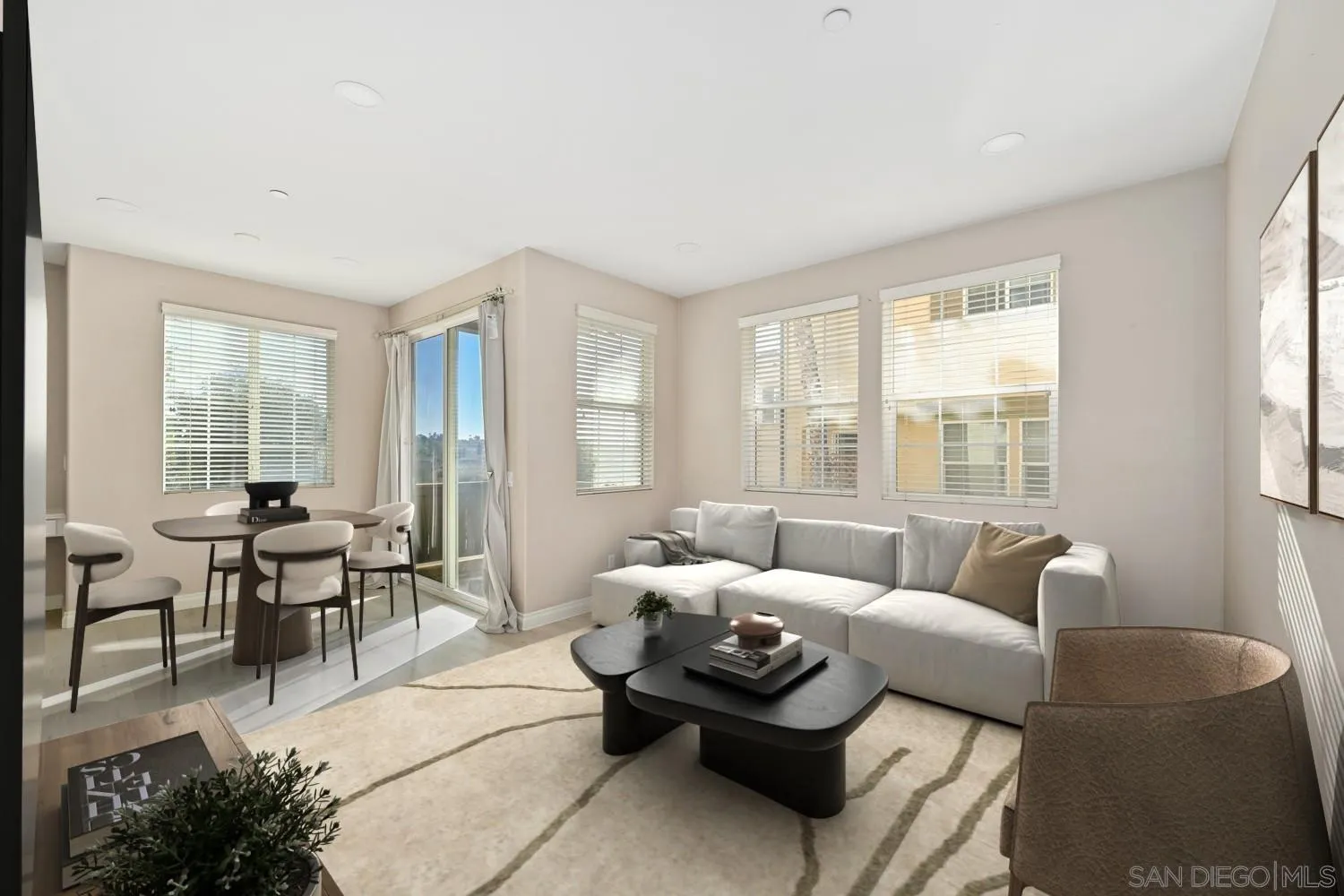 5074 Cascade Way, Unit 102 Oceanside, CA 92057 - Photo 4 of 30 a living room with furniture and large windows