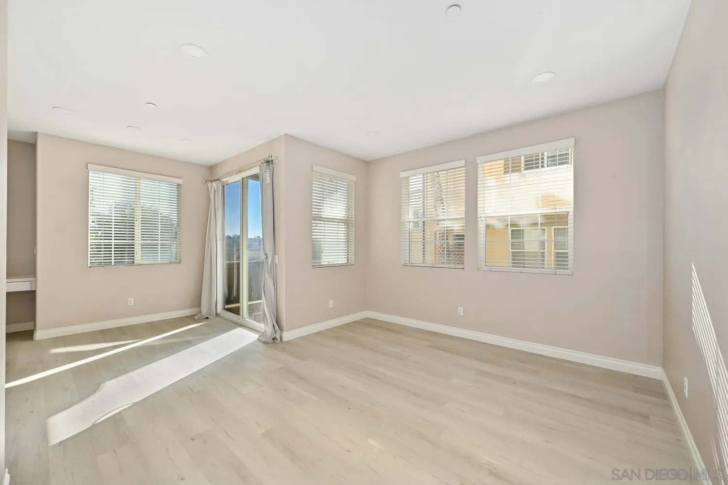 5074 Cascade Way, Unit 102 Oceanside, CA 92057 - Photo 5 of 30 an empty room with windows