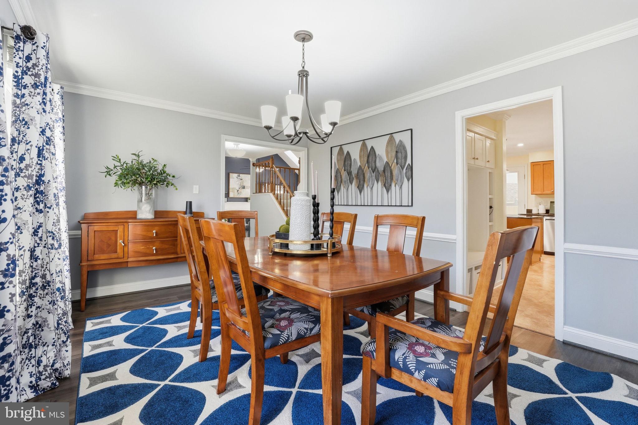 9115 Northedge Drive Springfield, VA 22153 - Photo 19 of 55 a view of a dining room with furniture and chandelier