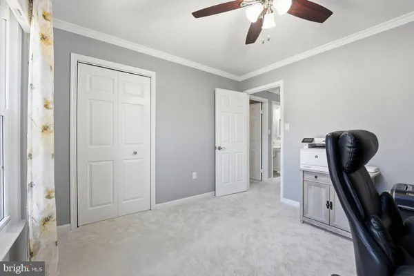 a bedroom with furniture and window