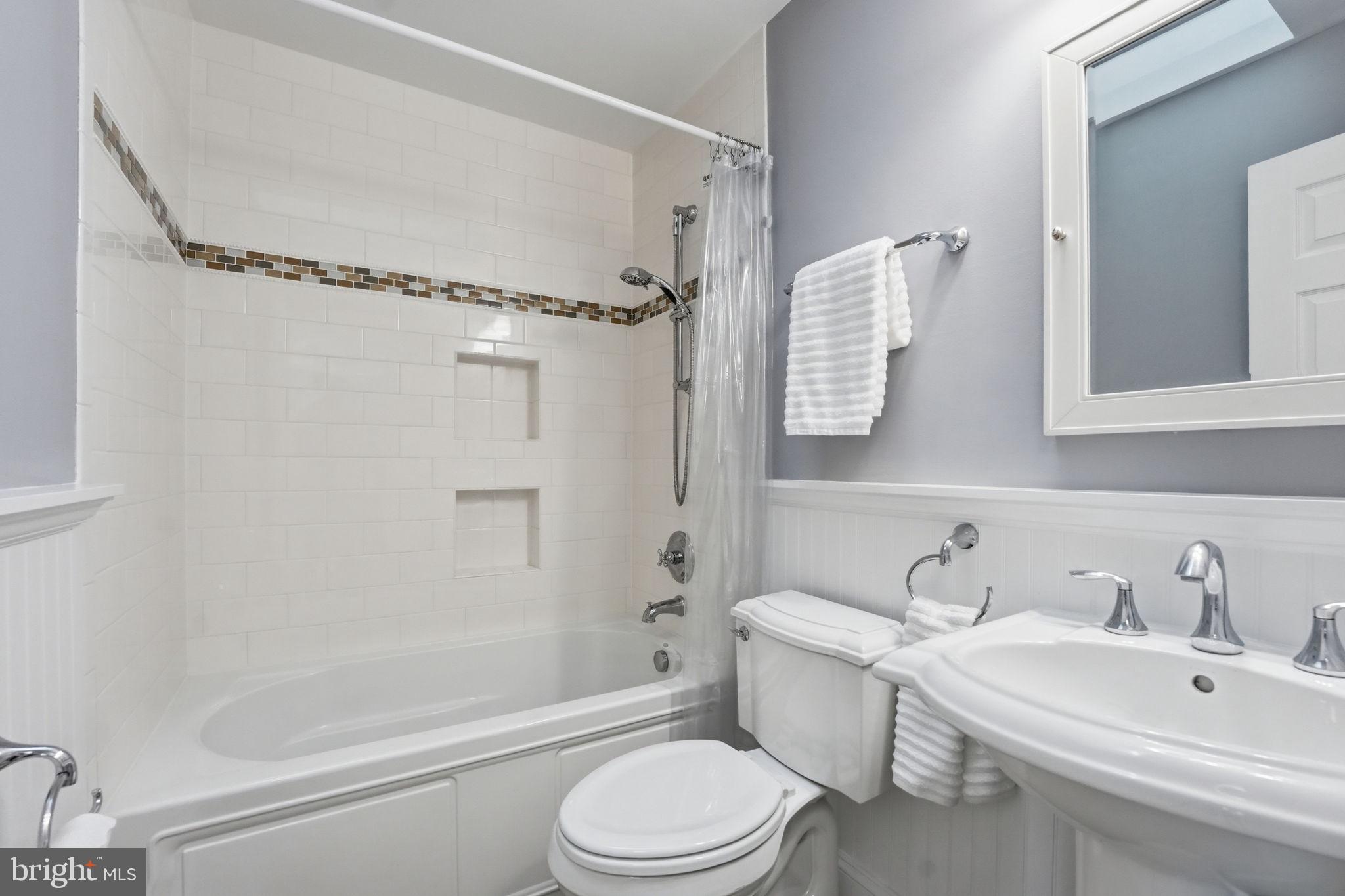 9115 Northedge Drive Springfield, VA 22153 - Photo 33 of 55 a bathroom with a sink toilet and shower