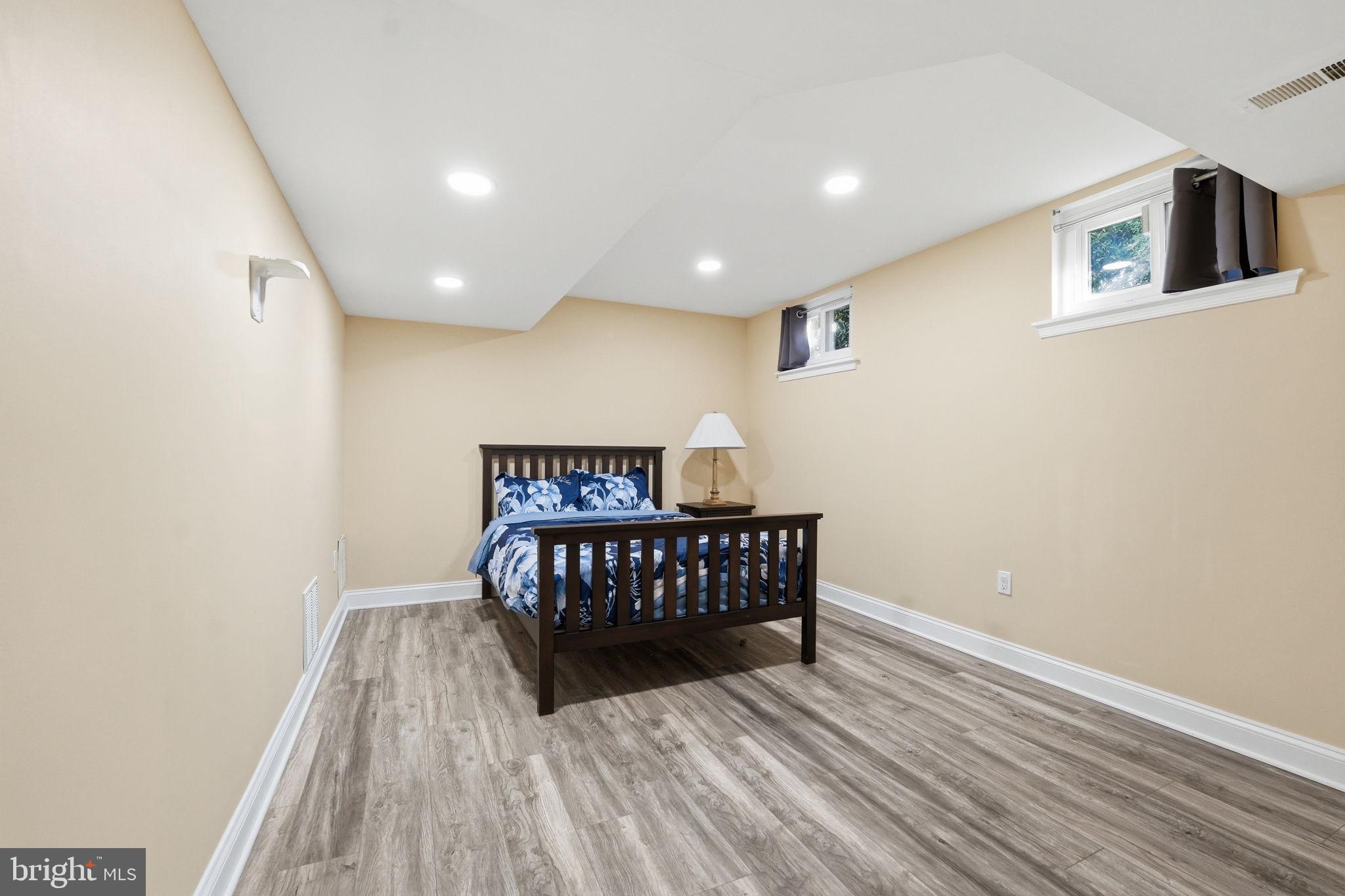 9115 Northedge Drive Springfield, VA 22153 - Photo 42 of 55 a bedroom with a bed and wooden floor