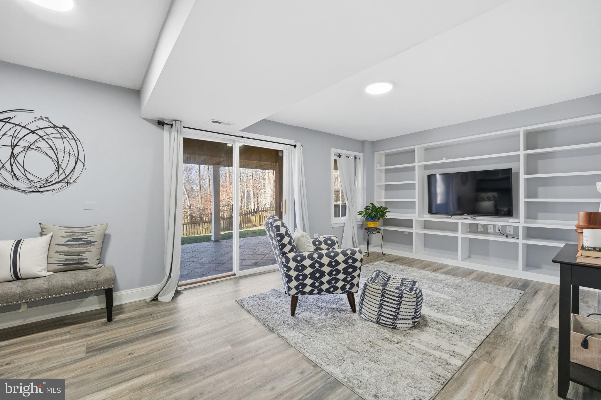 9115 Northedge Drive Springfield, VA 22153 - Photo 44 of 55 a living room with furniture and a flat screen tv