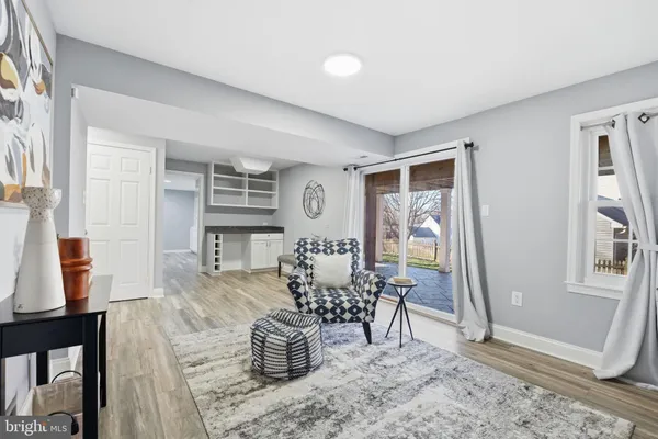 a bedroom with furniture and a wooden floor