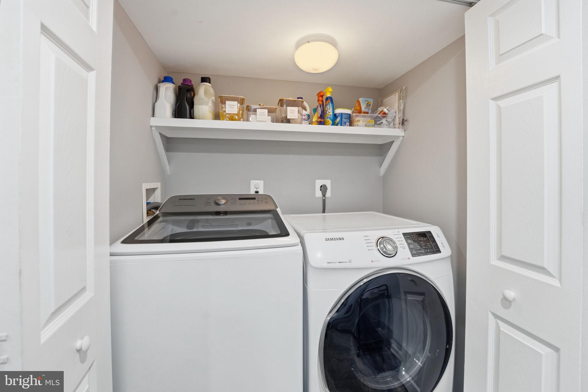 9115 Northedge Drive Springfield, VA 22153 - Photo 49 of 55 a utility room with dryer washer and empty racks