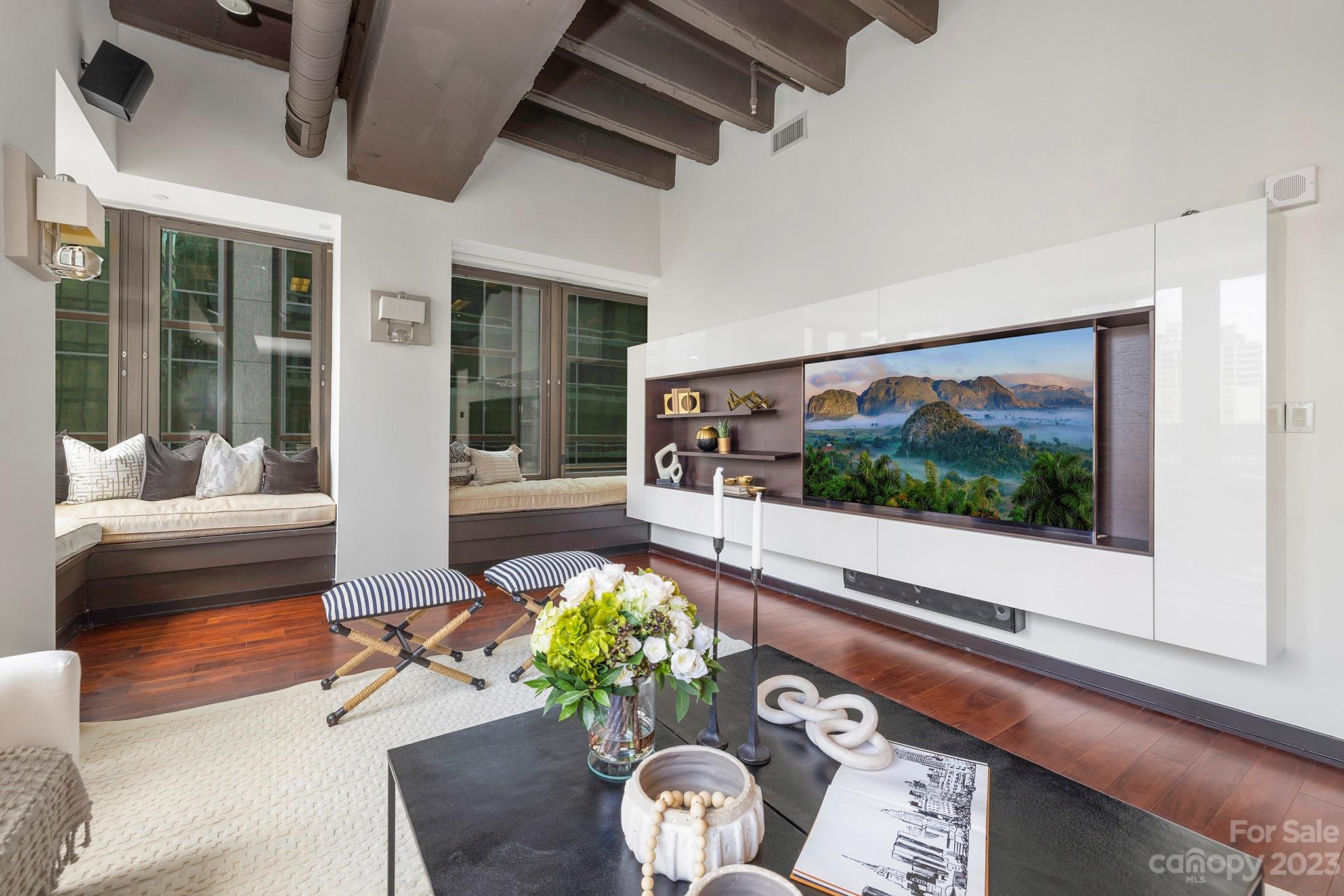 139 South Tryon Street, Unit 3B Charlotte, NC 28202 - Photo 14 of 21 a living room filled with furniture and a painting