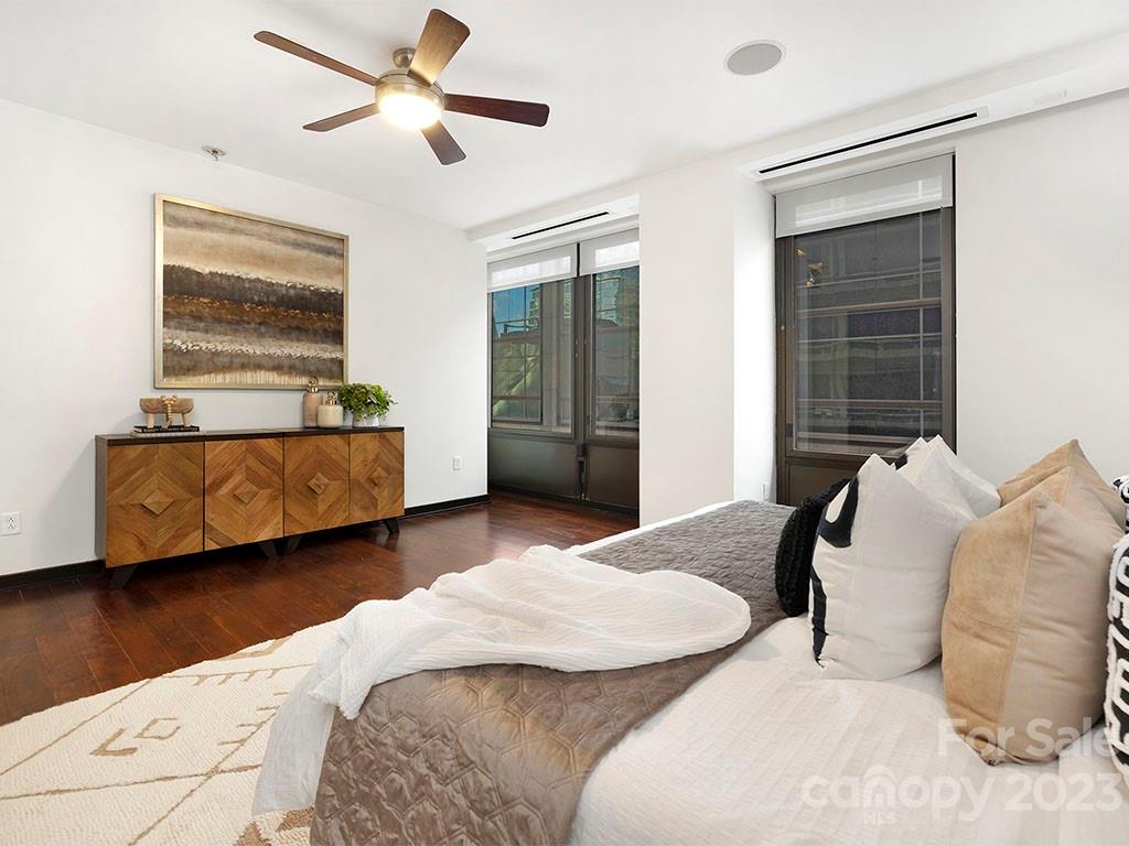 139 South Tryon Street, Unit 3B Charlotte, NC 28202 - Photo 18 of 21 a bedroom with two beds and a window