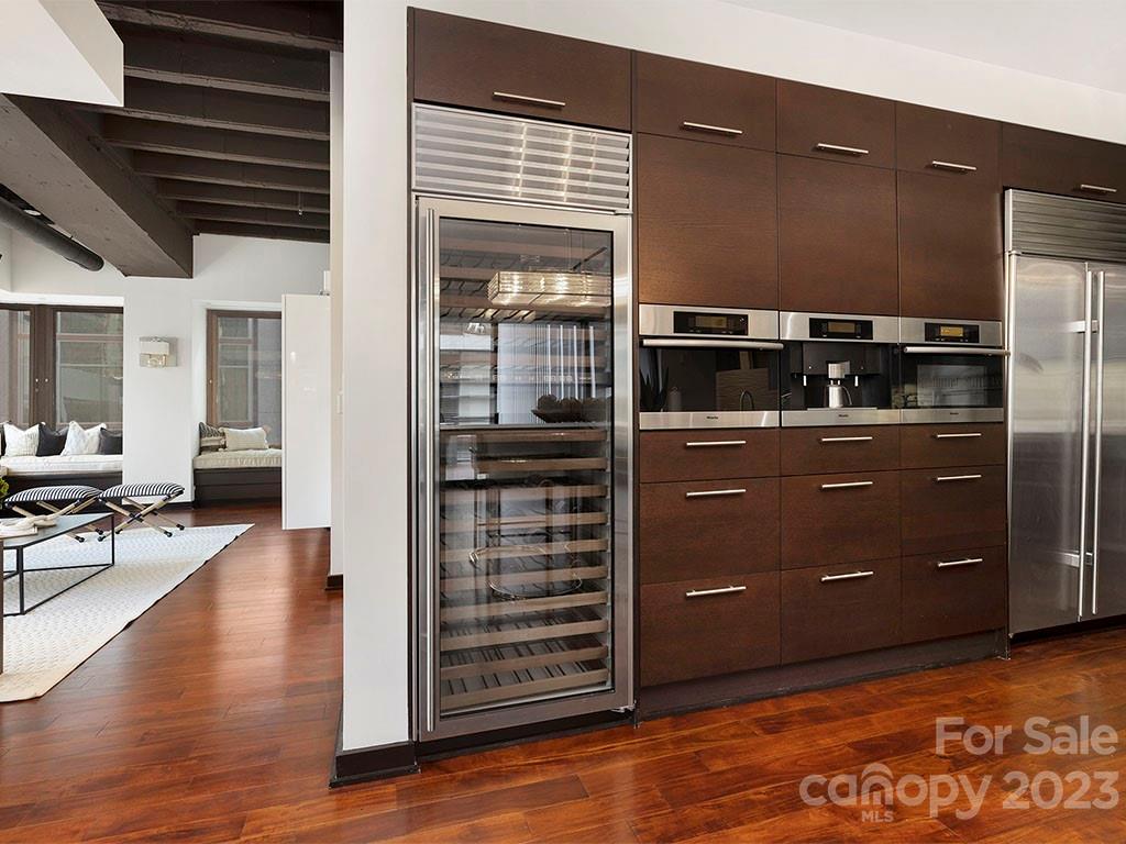 139 South Tryon Street, Unit 3B Charlotte, NC 28202 - Photo 6 of 21 a kitchen with a refrigerator and stove