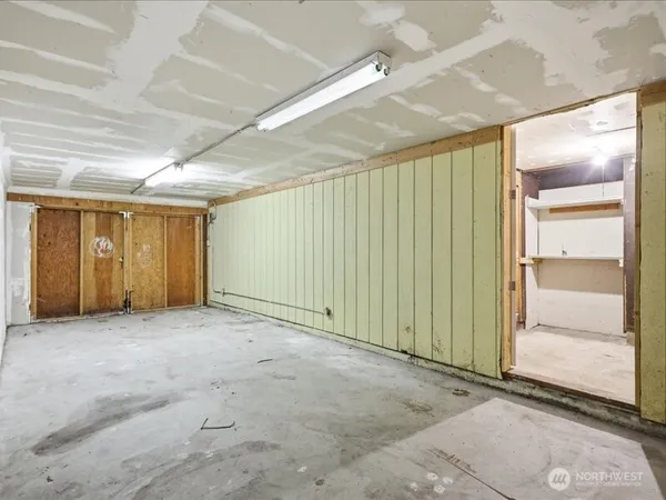 a view of a hallway with wooden shelves