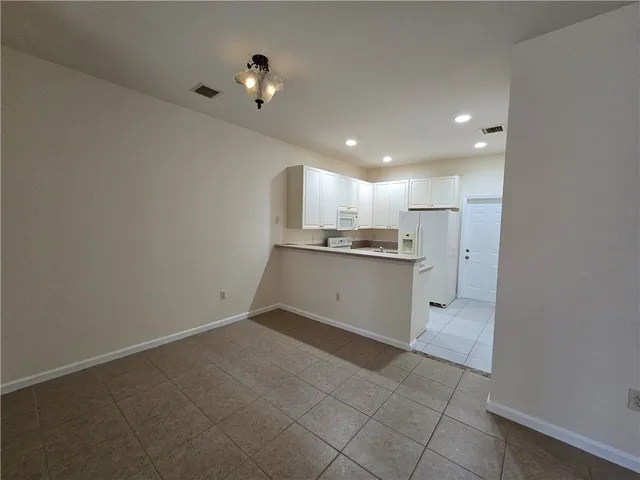 a view of a kitchen with a sink