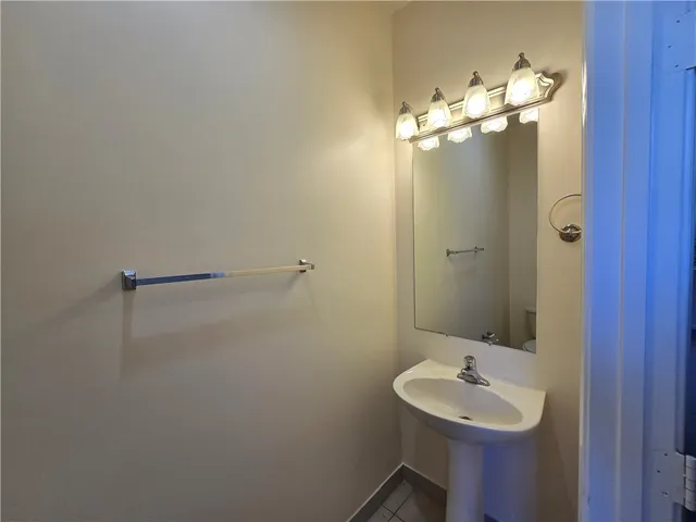 a bathroom with a sink and mirror