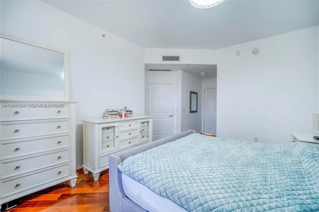 a bedroom with a bed and a walk in closet