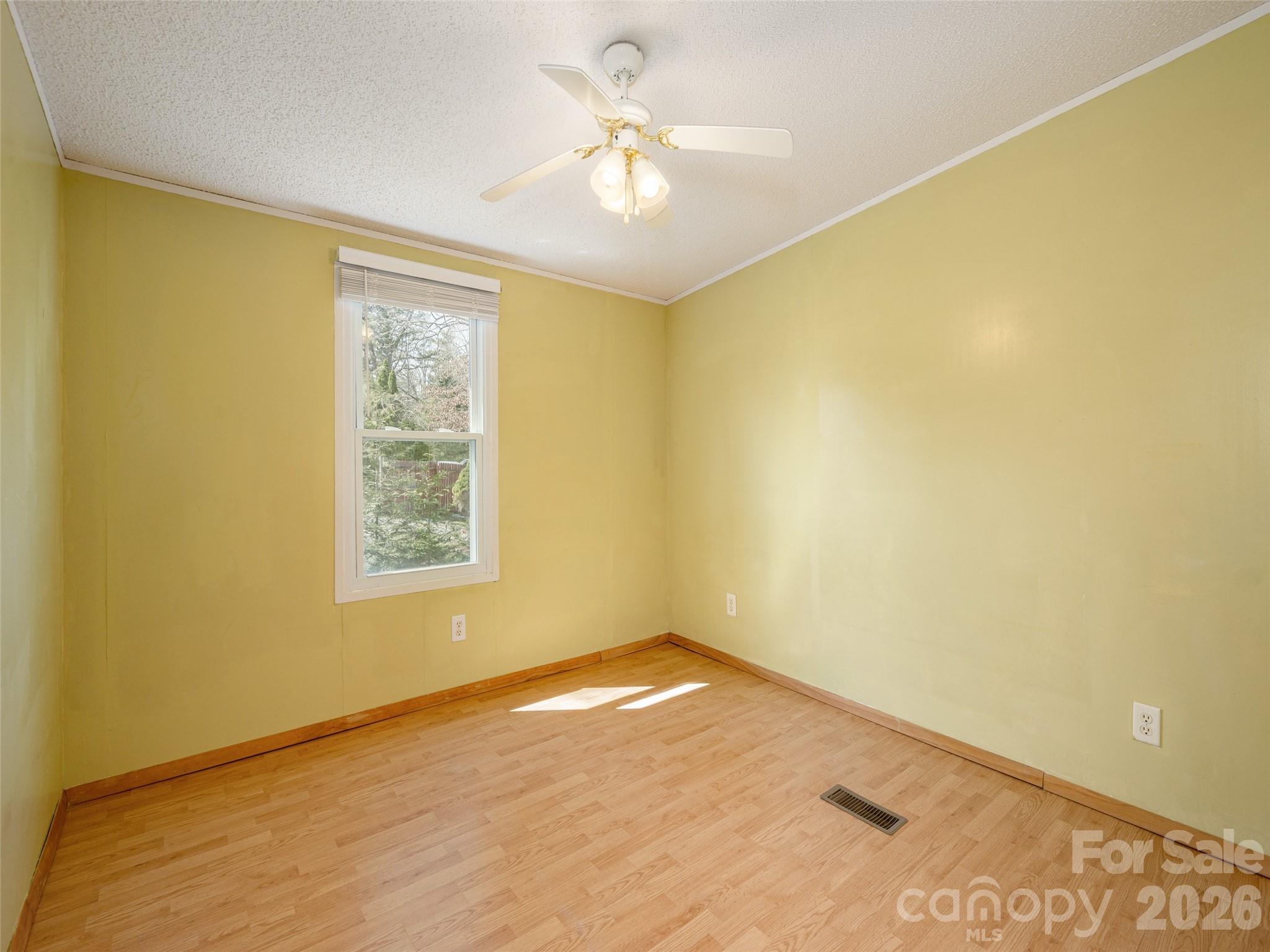 204 Cookies Way Arden, NC 28704 - Photo 13 of 22 a view of a big room with windows and chandelier fan