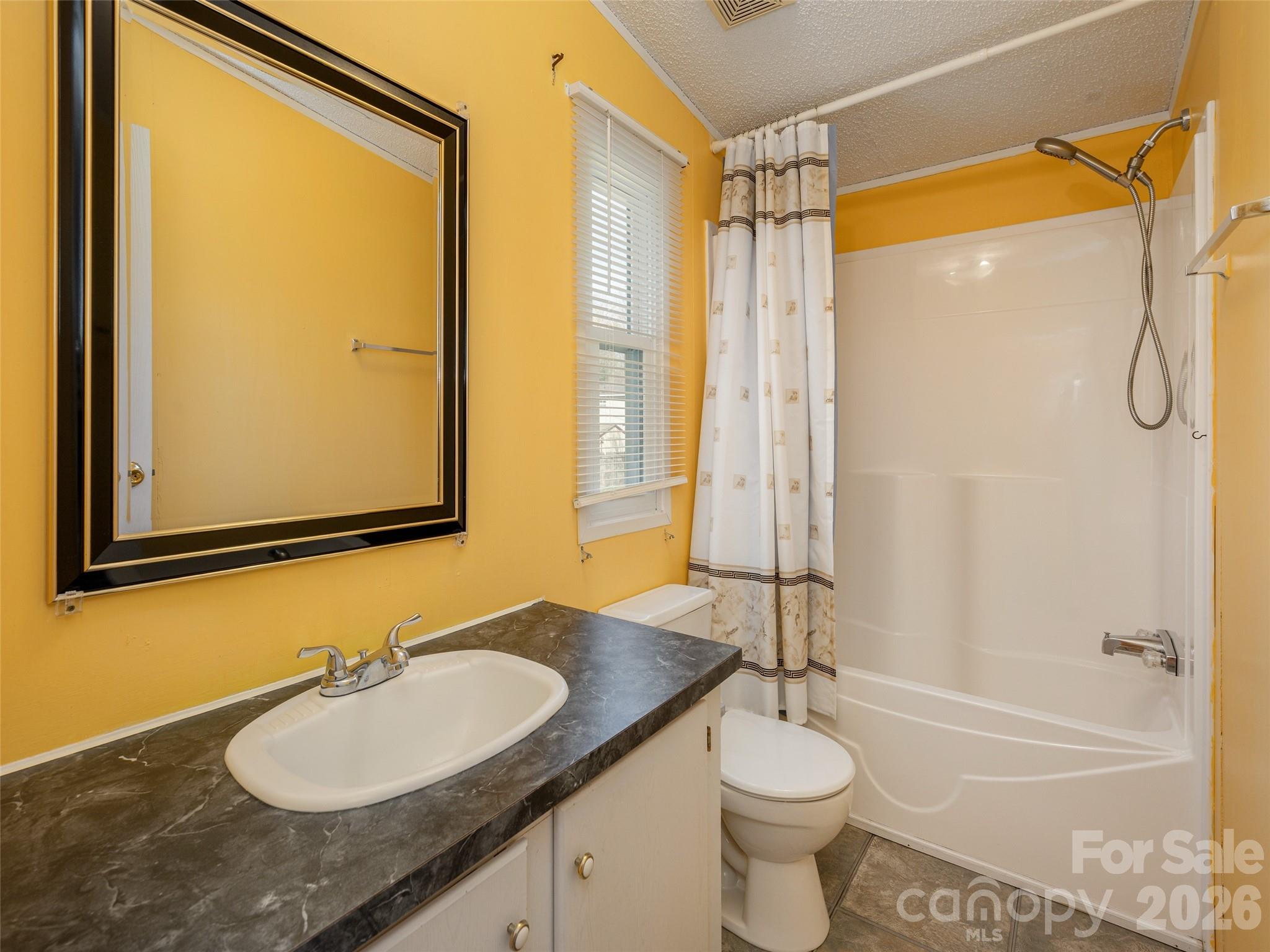 204 Cookies Way Arden, NC 28704 - Photo 15 of 22 a bathroom with a granite countertop sink toilet and shower