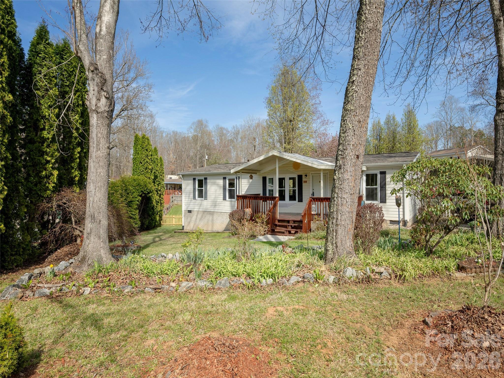 204 Cookies Way Arden, NC 28704 - Photo 20 of 22 a house view with a garden space