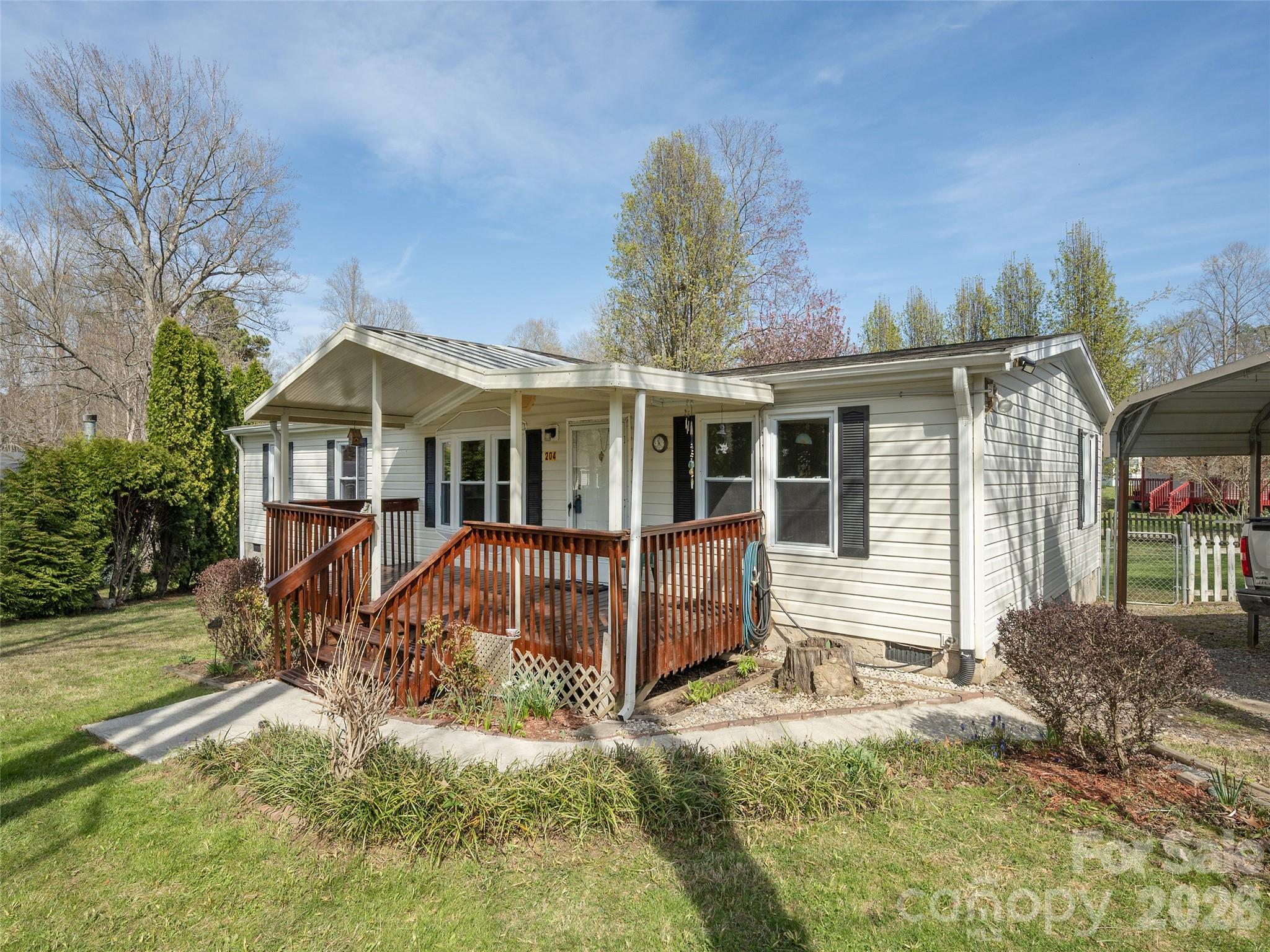 204 Cookies Way Arden, NC 28704 - Photo 2 of 22 a front view of a house with garden