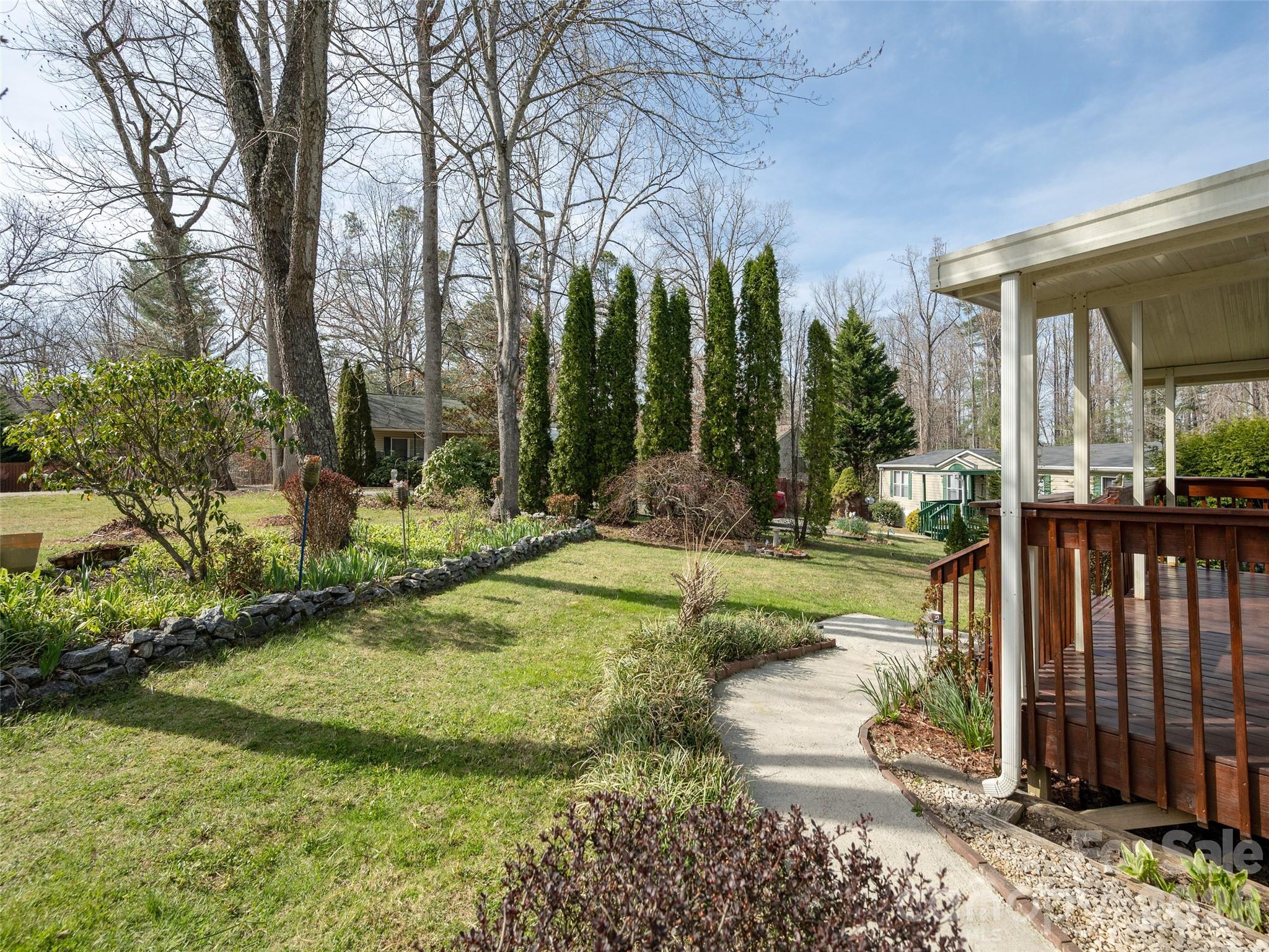 204 Cookies Way Arden, NC 28704 - Photo 21 of 22 a view of a house with backyard and sitting area
