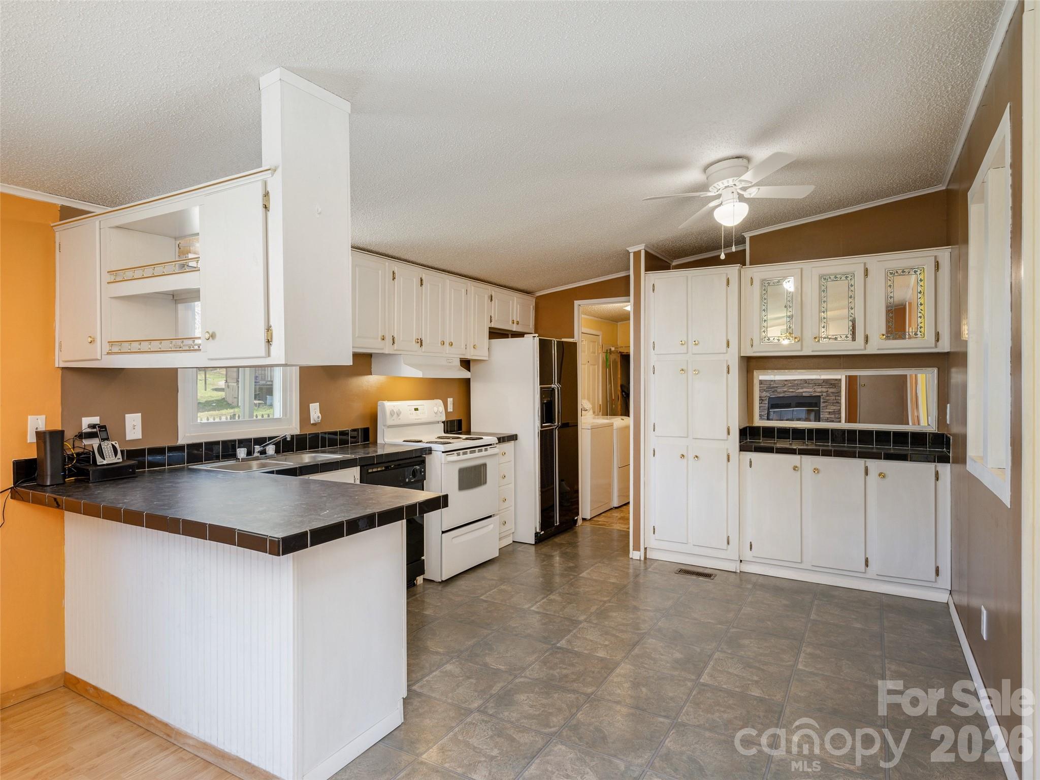 204 Cookies Way Arden, NC 28704 - Photo 8 of 22 a kitchen with stainless steel appliances granite countertop a stove a sink and a refrigerator