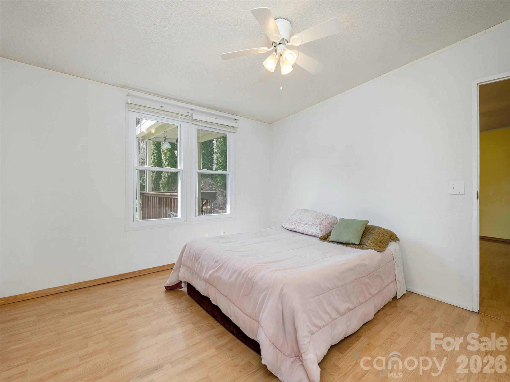 204 Cookies Way Arden, NC 28704 - Photo 10 of 22 a bedroom with a bed and a window