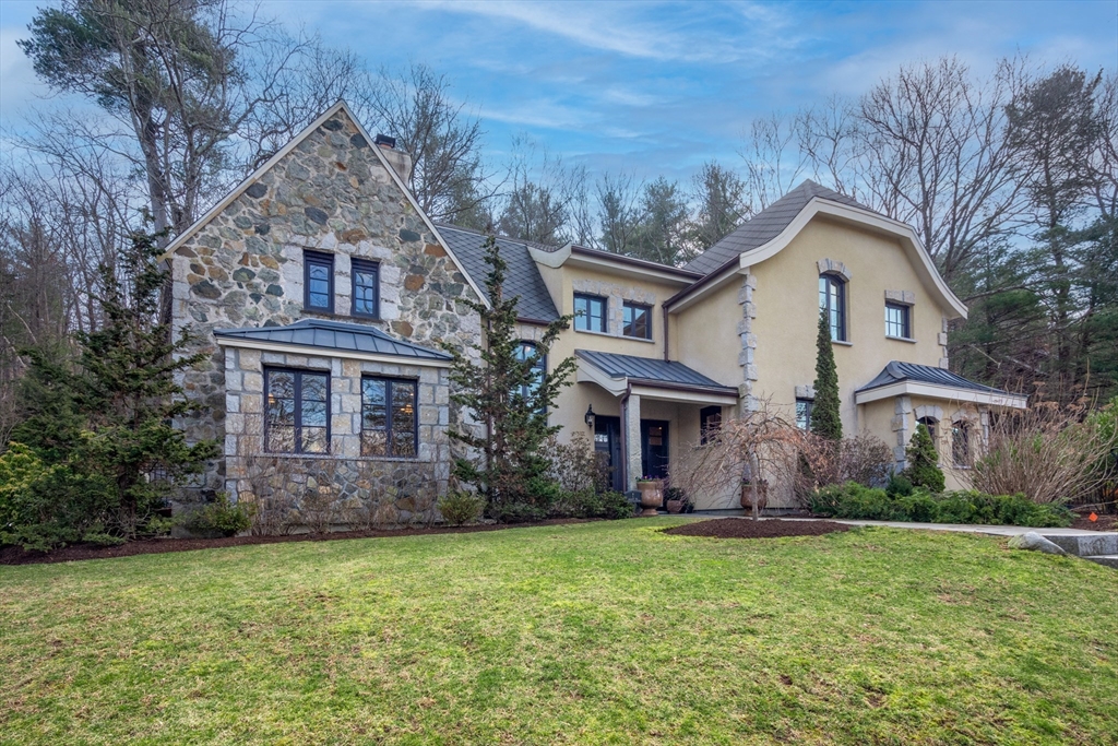 7 Wolcott Road Winchester, MA 01890 - Photo 1 of 41 a front view of a house with garden