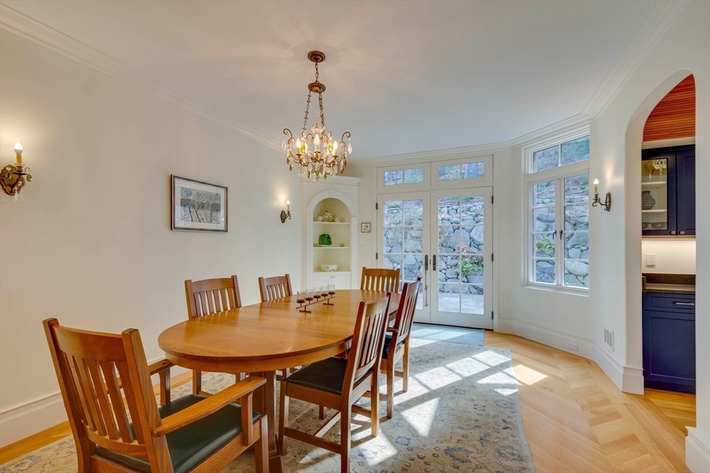 7 Wolcott Road Winchester, MA 01890 - Photo 17 of 41 a view of a dining room with furniture and chandelier