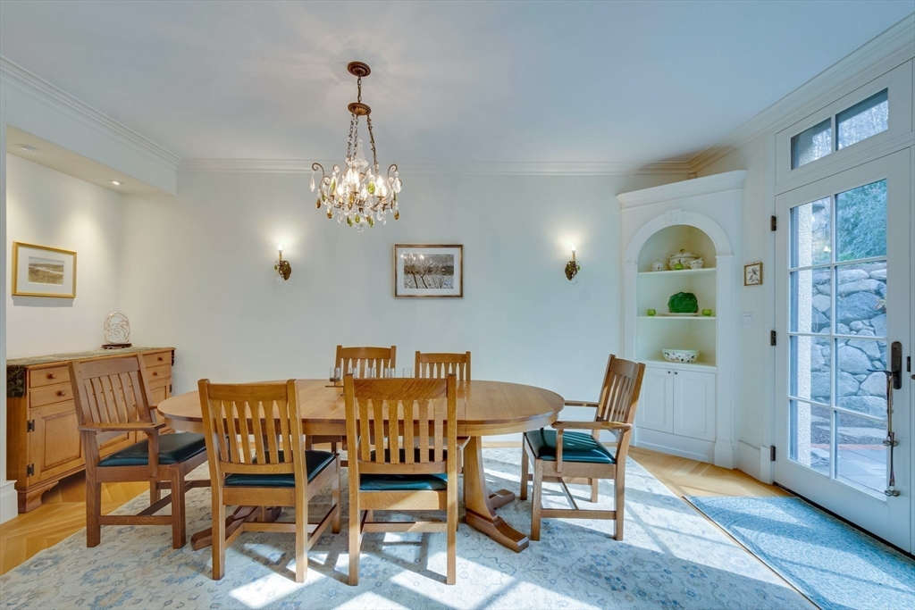 7 Wolcott Road Winchester, MA 01890 - Photo 18 of 41 a dining room with furniture and chandelier