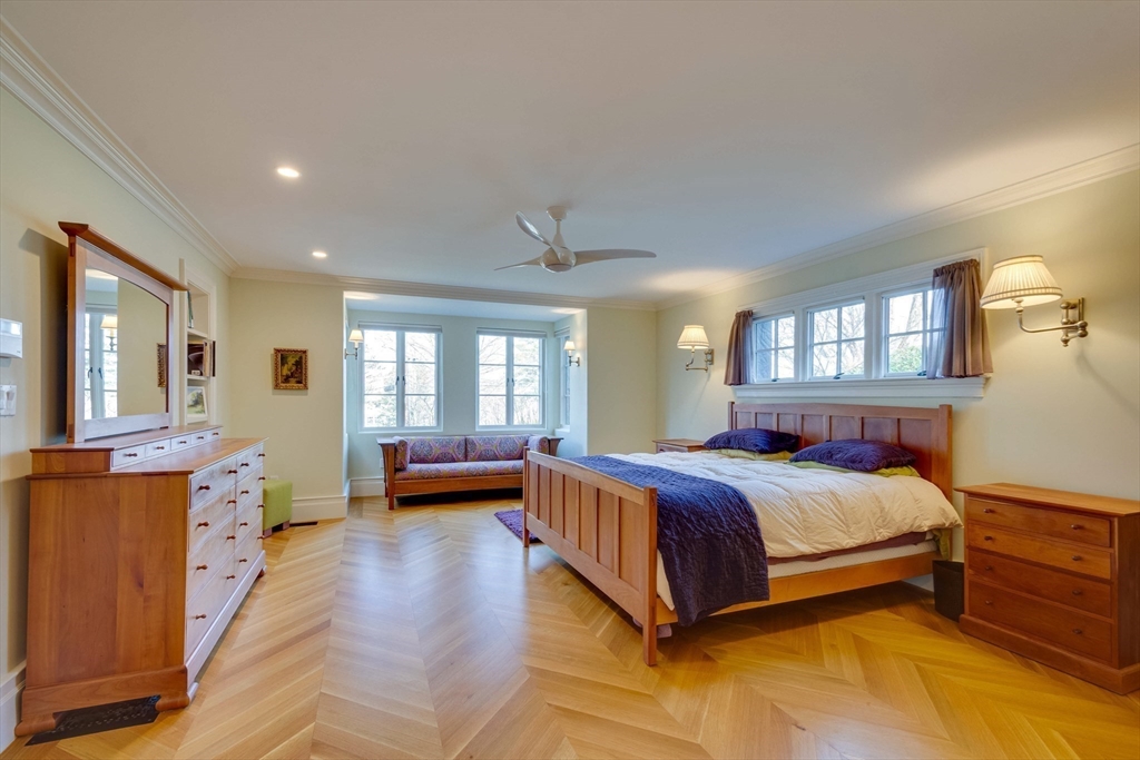 7 Wolcott Road Winchester, MA 01890 - Photo 19 of 41 a bedroom with a bed and wooden floor