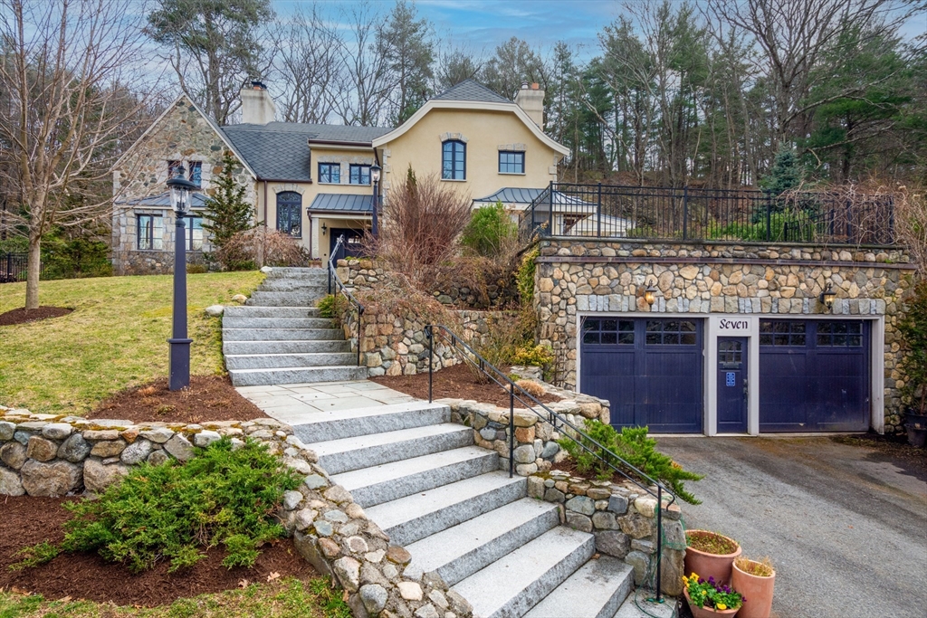 7 Wolcott Road Winchester, MA 01890 - Photo 2 of 41 a front view of a house with a yard