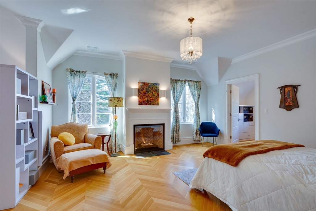 7 Wolcott Road Winchester, MA 01890 - Photo 25 of 41 a bedroom with a bed and a fireplace