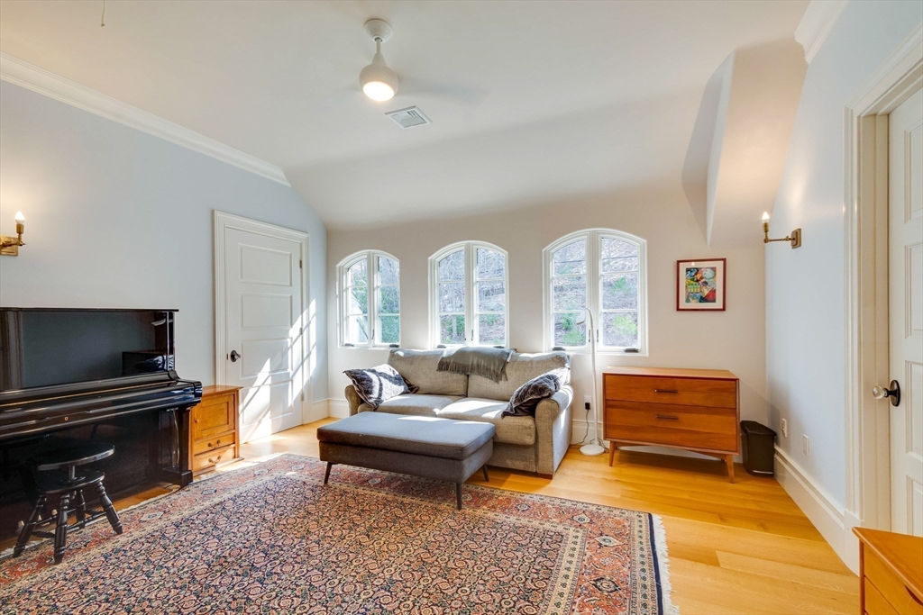 7 Wolcott Road Winchester, MA 01890 - Photo 30 of 41 a living room with furniture a piano and a flat screen tv