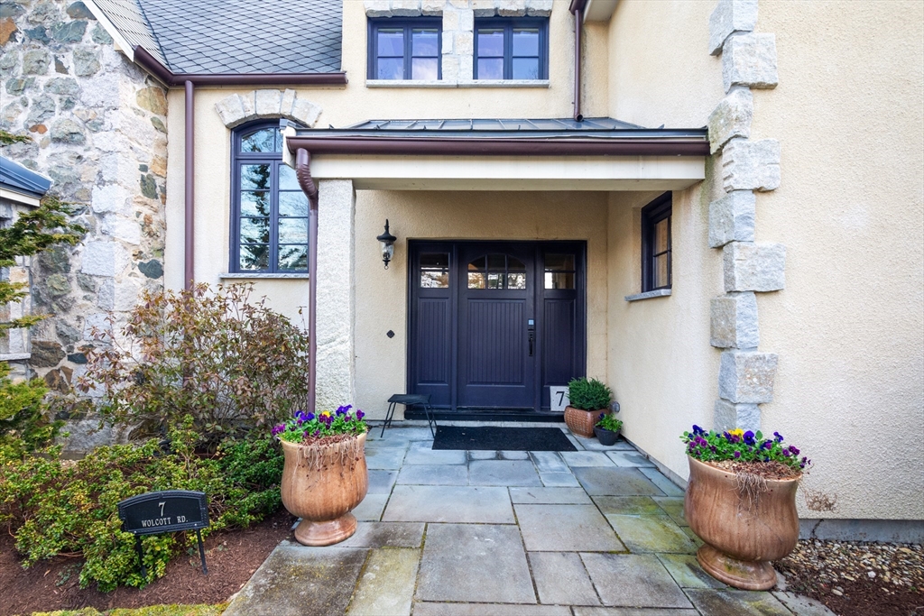 7 Wolcott Road Winchester, MA 01890 - Photo 3 of 41 a front view of a house with potted plants